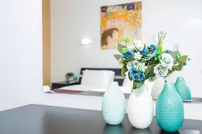 a group of blue and white vases sitting on a table at LAILA - Coralli Beachfront Apartment in Protaras
