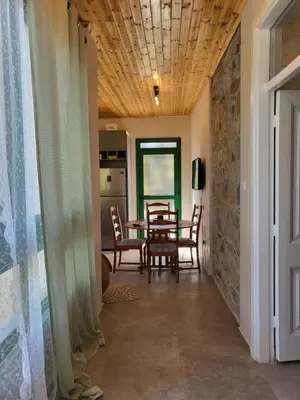 a dining room with a table and chairs at ThePlatres.Nest in Platres