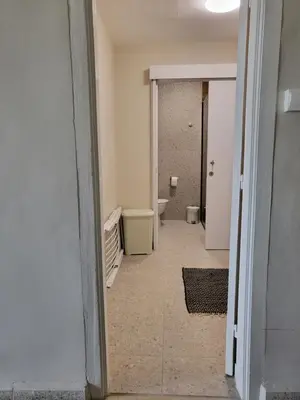 an empty hallway of a bathroom with a toilet at ThePlatres.Nest in Platres