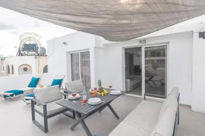 a living room with a table and chairs at Evas Apartment in Protaras