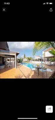 a picture of a pool with a table and chairs at Villa 4 in Ayia Thekla in Ayia Napa