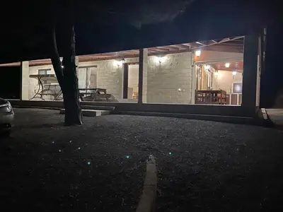 a house at night with a tree in the yard at Stavros Country House in Siá