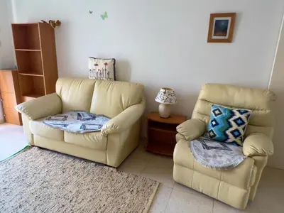 a living room with two chairs and a couch at TaniAndres apartments in Paralimni