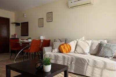 a living room with a couch and a table at Nissi 3 C14 Sea View Top Floor Apartment in Ayia Napa