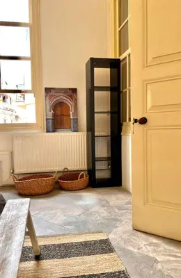 a room with a door and baskets on the floor at The Old Town Heritage House in Nicosia