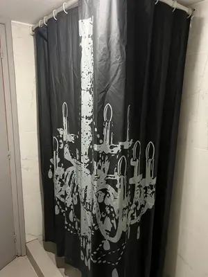 a black curtain with a chandelier in a bathroom at APHRODITE 2 Bedroom Apartment Down Town Nicosia in Nicosia