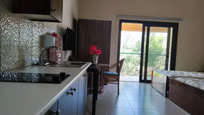 a kitchen with a sink and a counter top at Limeria in Alona