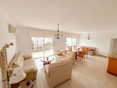 a living room with a couch and a table at Samson Sea Breeze, 3bed sleeps 6, free WiFi in Limassol