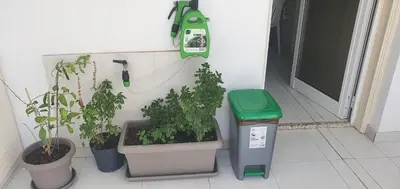 a room with potted plants and a phone on the wall at STEFARIS 