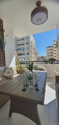 a table with two wine glasses on a balcony at STEFARIS 