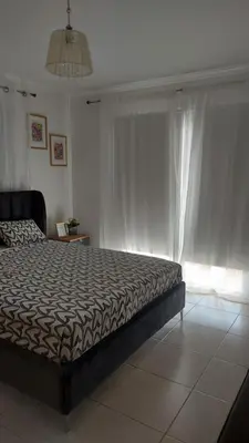 a bedroom with a bed and a window at Nissi Golden Sands Sunny Apartment A1D4 in Ayia Napa