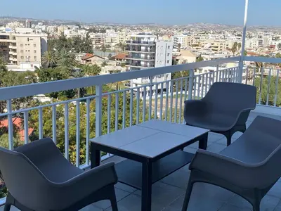 a table and chairs on a balcony with a view at INCREDIBLE VIEW in Larnaka