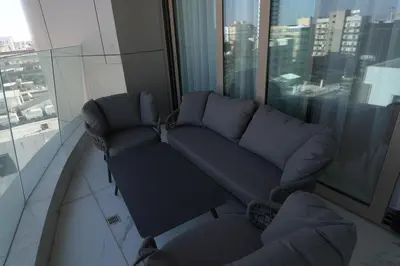 a living room with a couch and chairs in a building at 360 Nicosia - 1 bedroom Luxurious Residence in Nicosia