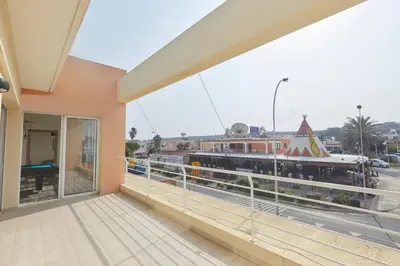 a balcony with a view of a train yard at Spectacular Sea View, private jacuzzi & table pool in Protaras