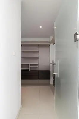 a walk in closet with a glass door at Palace of Mediterranean Beachfront Villa in Ayia Napa