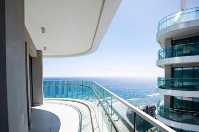 a view of the ocean from the balcony of a building at Del Mar Beachfront 3 Bedroom 'C' Residence in Limassol