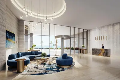 a living room with blue couches and a table at Del Mar Beachfront 3 Bedroom 'C' Residence in Limassol