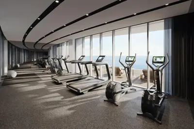 a gym with a row of treadmills at Del Mar Beachfront 3 Bedroom 'C' Residence in Limassol