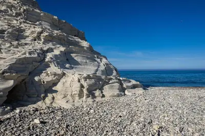 a rocky beach with the ocean in the background at Pissouri bay studio in Pissouri