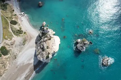 an aerial view of a rock formation in the ocean at Pissouri bay studio in Pissouri