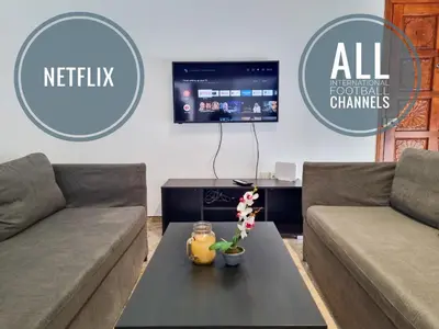 a living room with two couches and a table at Luxury City Rooms - Smart TV with Netflix in Larnaka