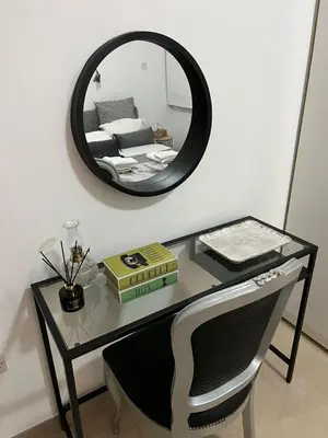 a desk with a mirror and a bed in a room at HESTIA Studio Downtown Nicosia in Nicosia