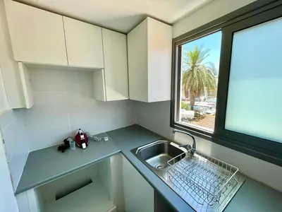 a small kitchen with a sink and a window at Nemesis Second floor studio in downtown Nicosia in Nicosia