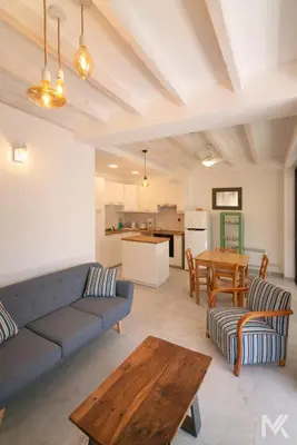 a living room with a couch and a table at Balkoni Moutoullas in Moutoullas