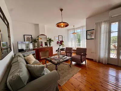a living room with a couch and a table at Liberty House - Central Two Bedroom Apartments in Nicosia