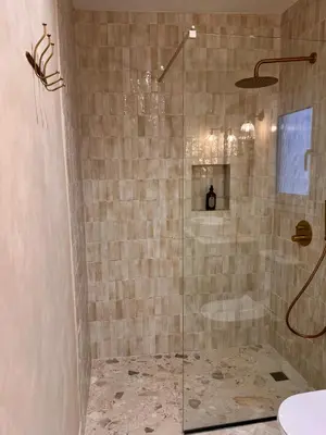 a bathroom with a shower with a glass door at Liberty House - Central Two Bedroom Apartments in Nicosia