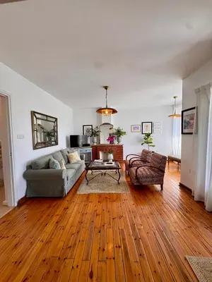 a living room with a couch and a table at Liberty House - Central Two Bedroom Apartments in Nicosia