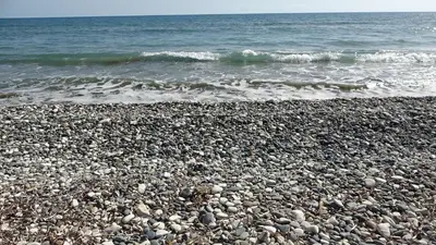 a rocky beach with the ocean in the background at Spyros No23 Charming Oceanview Maisonette in Meneou