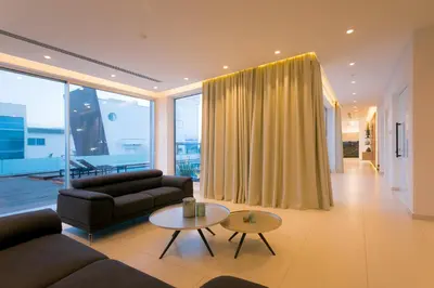 a living room with a couch and a table at Cove Seaview Villas - Nautica in Ayia Napa
