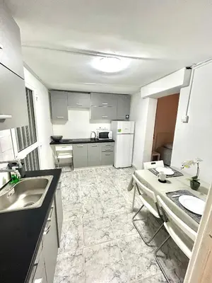 a kitchen with a sink and a table in it at Avra House in Limassol