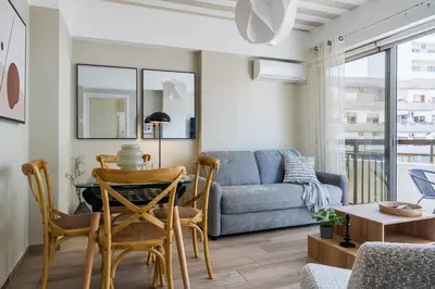a living room with a couch and a table at Berries 1-BR Apt in Larnaca in Larnaka