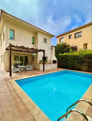 a swimming pool in front of a house at El Soleo Luxury Villa in Limassol