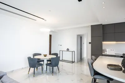 a kitchen and dining room with a table and chairs at 360 Nicosia - 2 bedrooms Luxury Residence in Nicosia