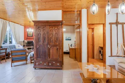a living room with a large wooden cabinet at House Eufrosyne in Moutoullas