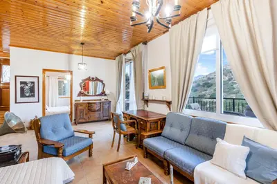 a living room with a couch and a table at House Eufrosyne in Moutoullas