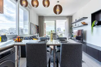 a kitchen with a dining table and chairs with a view at Sunflower 1-Bedroom Apartment in Larnaca in Larnaka