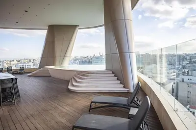 a balcony of a building with a table and chairs at 360 Nicosia-3 bedrooms Panoramic Deluxe Residence in Nicosia