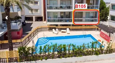 a large swimming pool in front of a building at LINA'S HOME & POOL - Breakbooking CY in Laxia