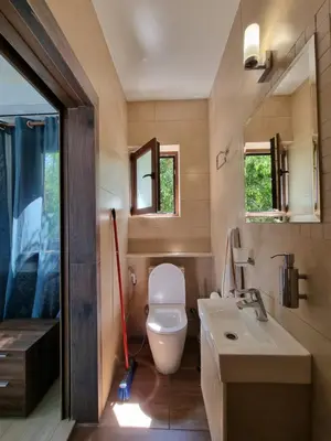 a bathroom with a toilet and a sink and a mirror at Mosaic villa by the sea in Protaras