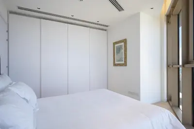 a bedroom with a white bed and a window at 360 Nicosia-3 bedrooms Exclusive Panoramic View Residence in Nicosia