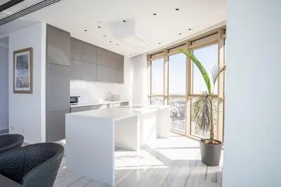 a kitchen with a white island and a potted plant at 360 Nicosia-3 bedrooms Exclusive Panoramic View Residence in Nicosia