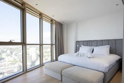 a bedroom with a large white bed with windows at 360 Nicosia-3 bedrooms Exclusive Panoramic View Residence in Nicosia