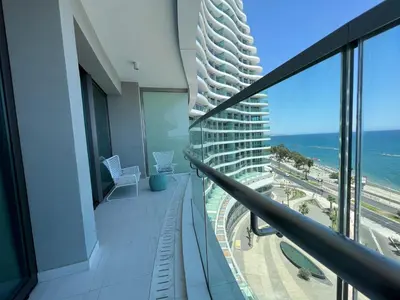 a balcony of a building with a view of the ocean at Del Mar Beachfront Boutique Residence in Limassol