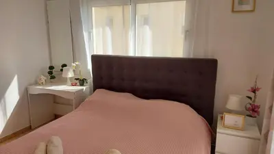 a bedroom with a large bed and a window at NISSI GOLDEN SANDS SEA VIEW 2 BEDROOM Apartment in Ayia Napa