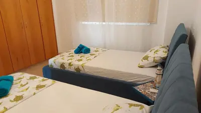 two beds in a small room with two beds at NISSI GOLDEN SANDS SEA VIEW 2 BEDROOM Apartment in Ayia Napa