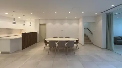 a kitchen and dining room with a table and chairs at Vivo Mare Beachfront Villas - Seashell in Ayia Napa